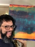 Artist Nestor Toro is seen with his recently sold abstract artwork titled - Perhaps a Sunset