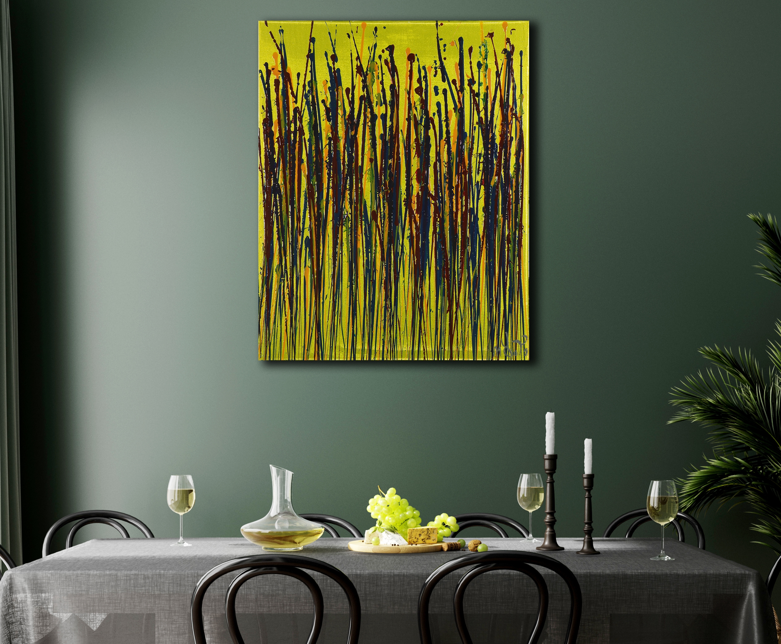 The work hanging on a green wall